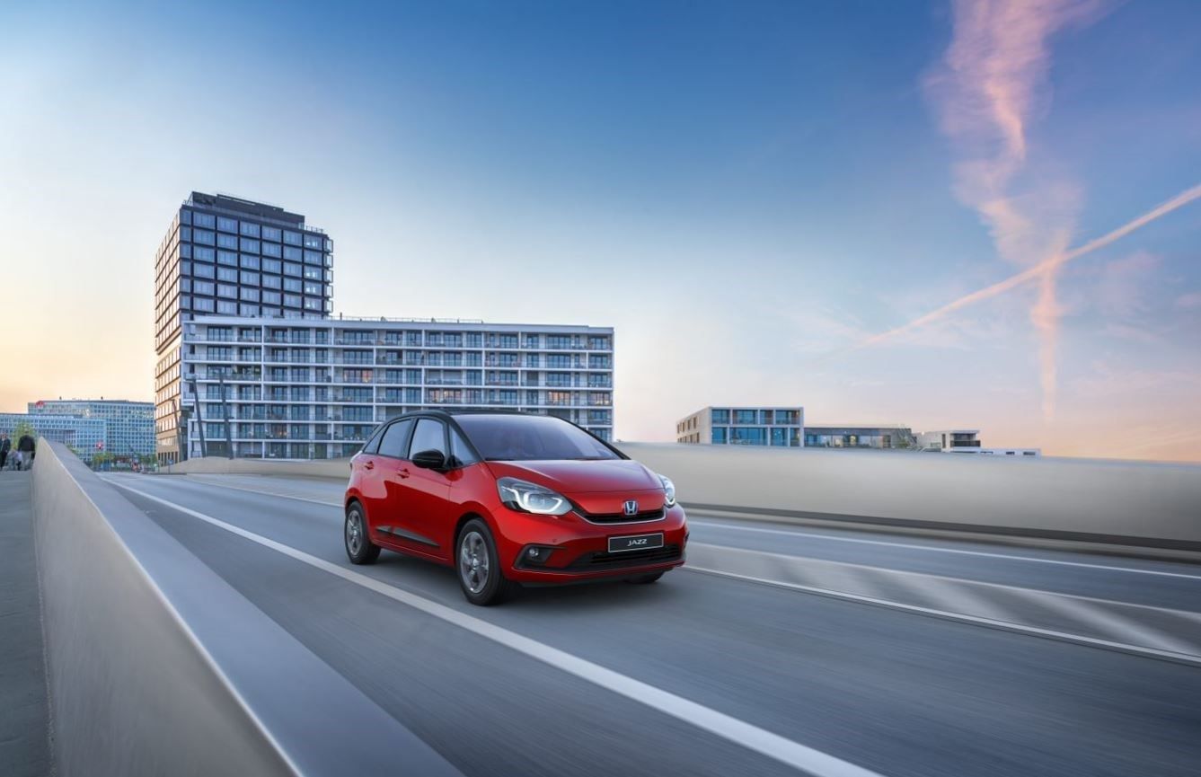 Red Honda Jazz driving on the motorway