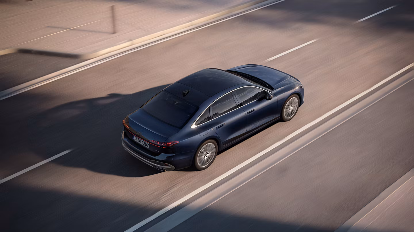 Audi A6 Saloon Driving On Road Rear View