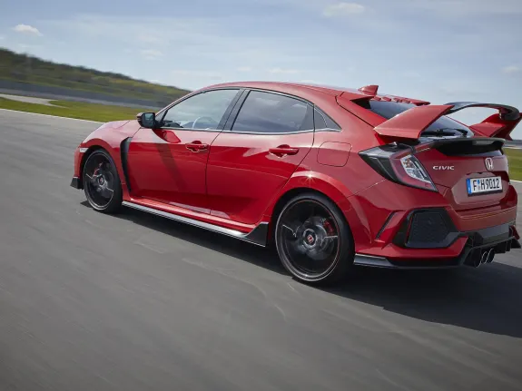 Red civic type r with Spoiler driving on a race track