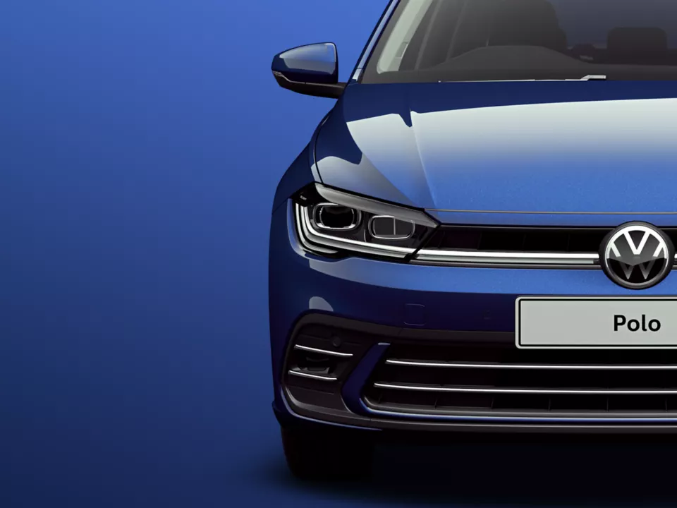 Close Up of the VW Polo Headlights and Badge