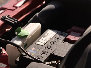Open bonnet with close up of the varta car battery
