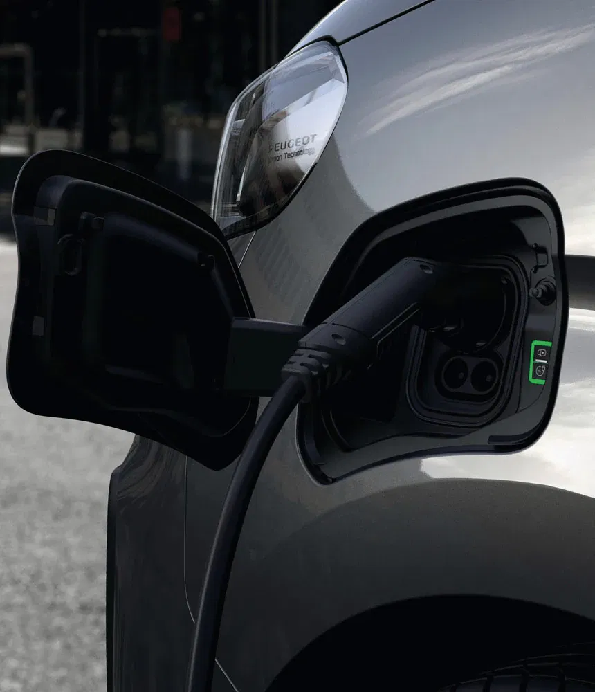 close up of e traveller charging port with cable plugged in