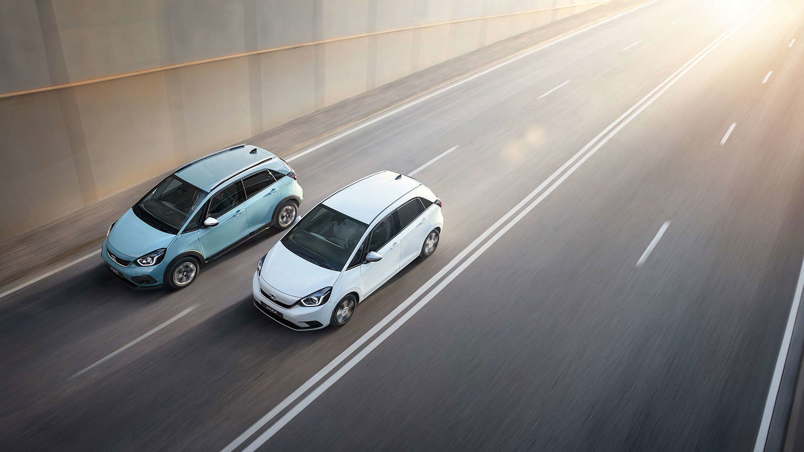 Honda Jazz and Jazz Crosstar driving down a road