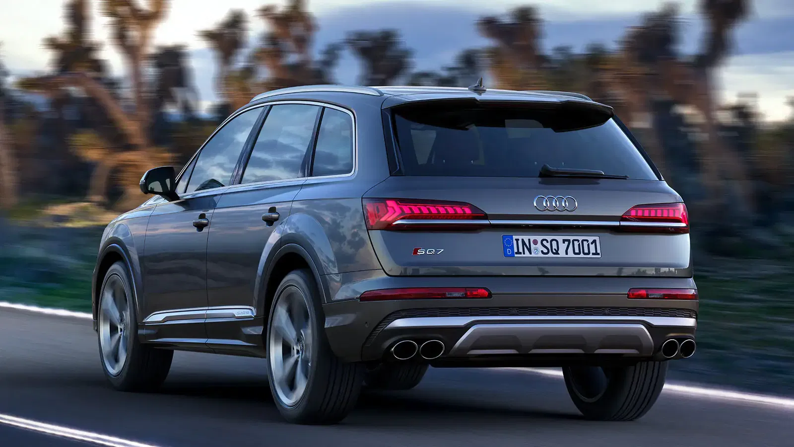 rear view of audi sq7 driving on a road