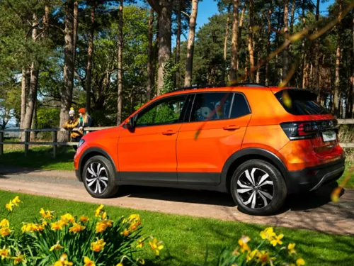 side view of orange vw t cross