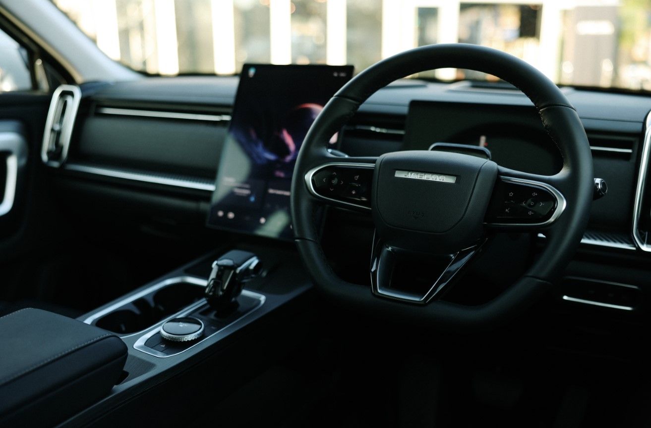 jaecoo interior , close up shot of steering wheel and infotainment